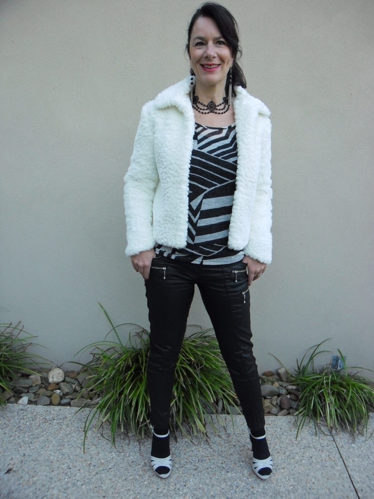 Black leather pants, white fur