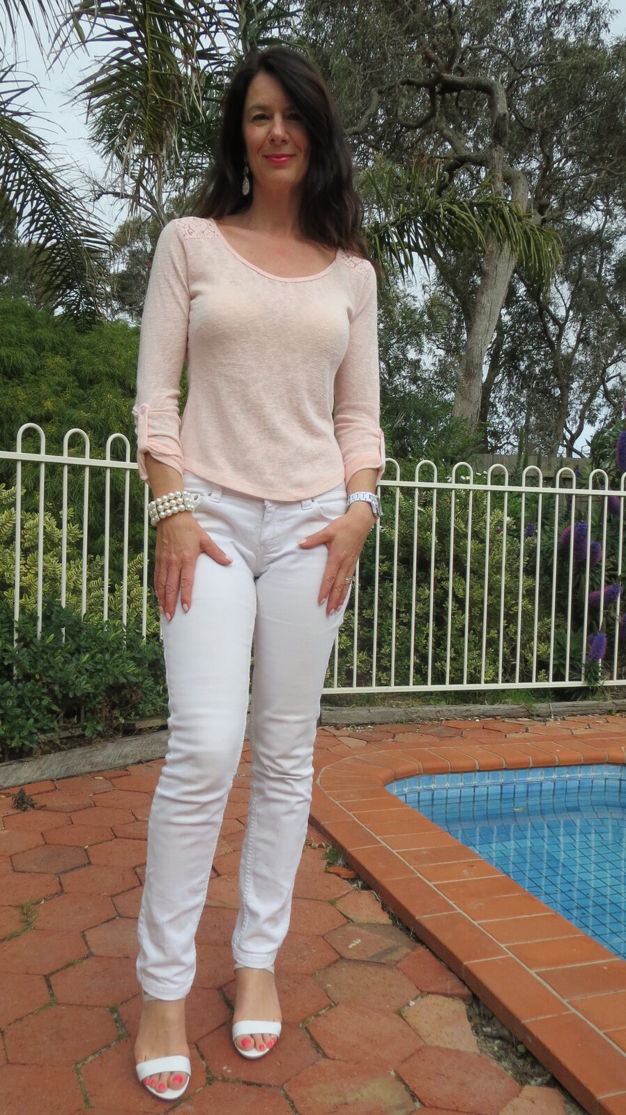 White jeans, pale pink top