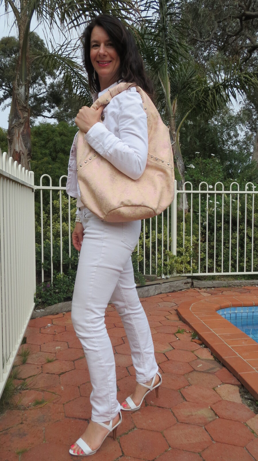 White jeans, pink bag