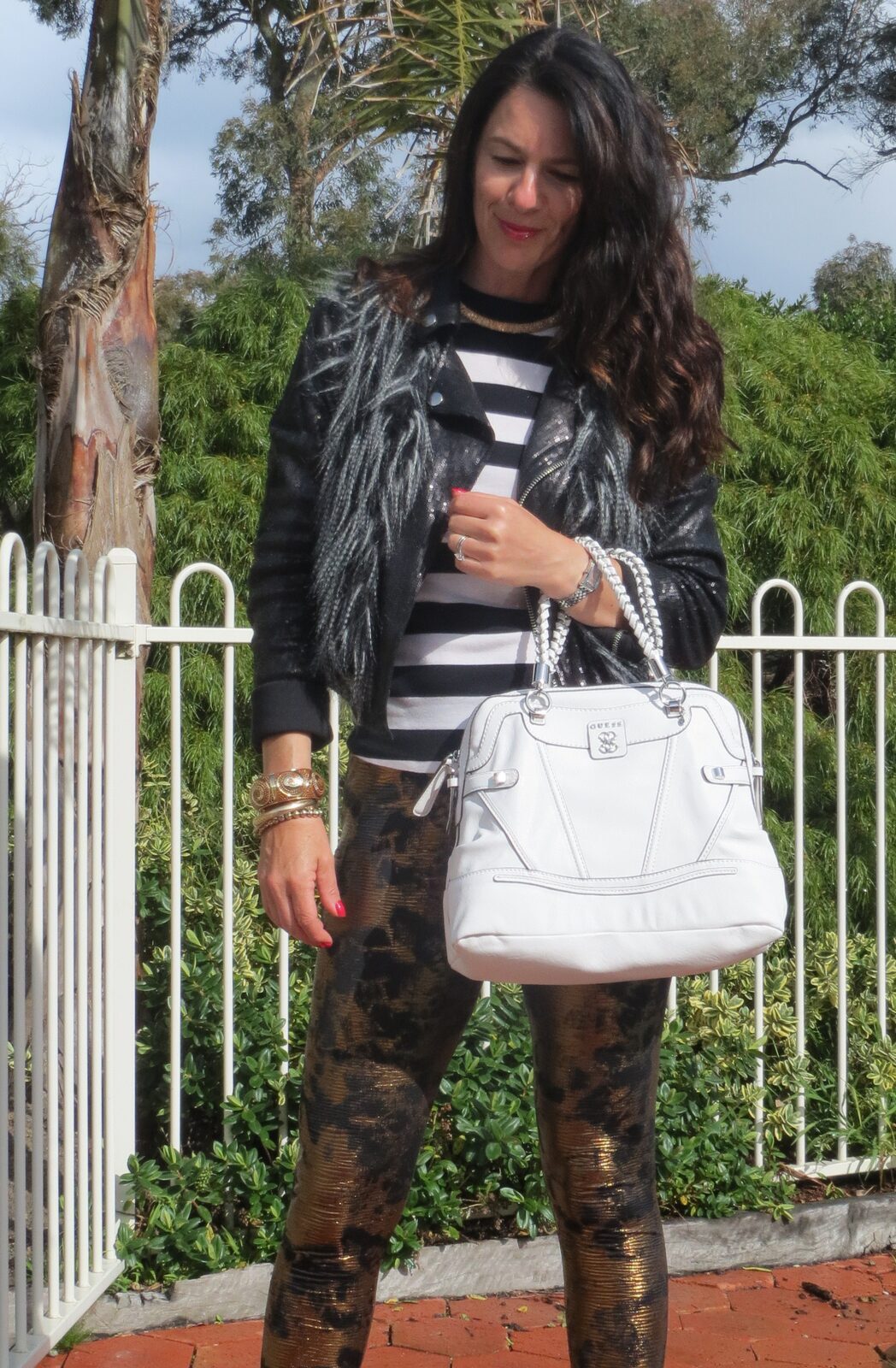 Gold leggings, white bag close
