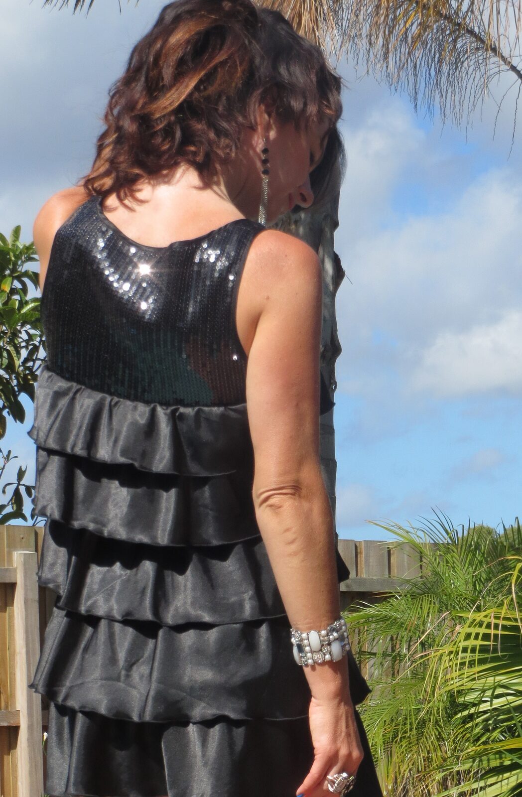 Black ruffle, sequin dress, back close