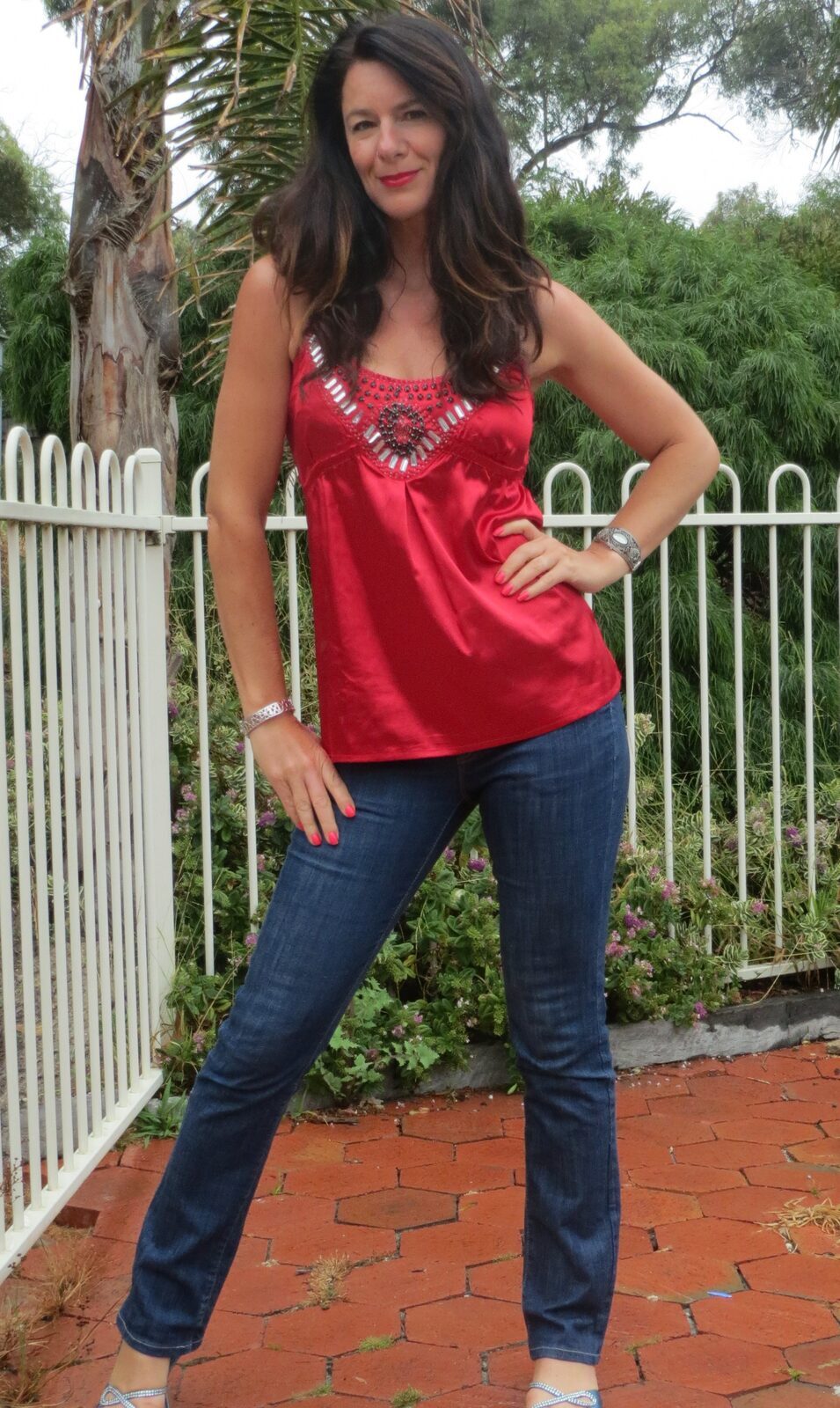 Red silk top, jeans