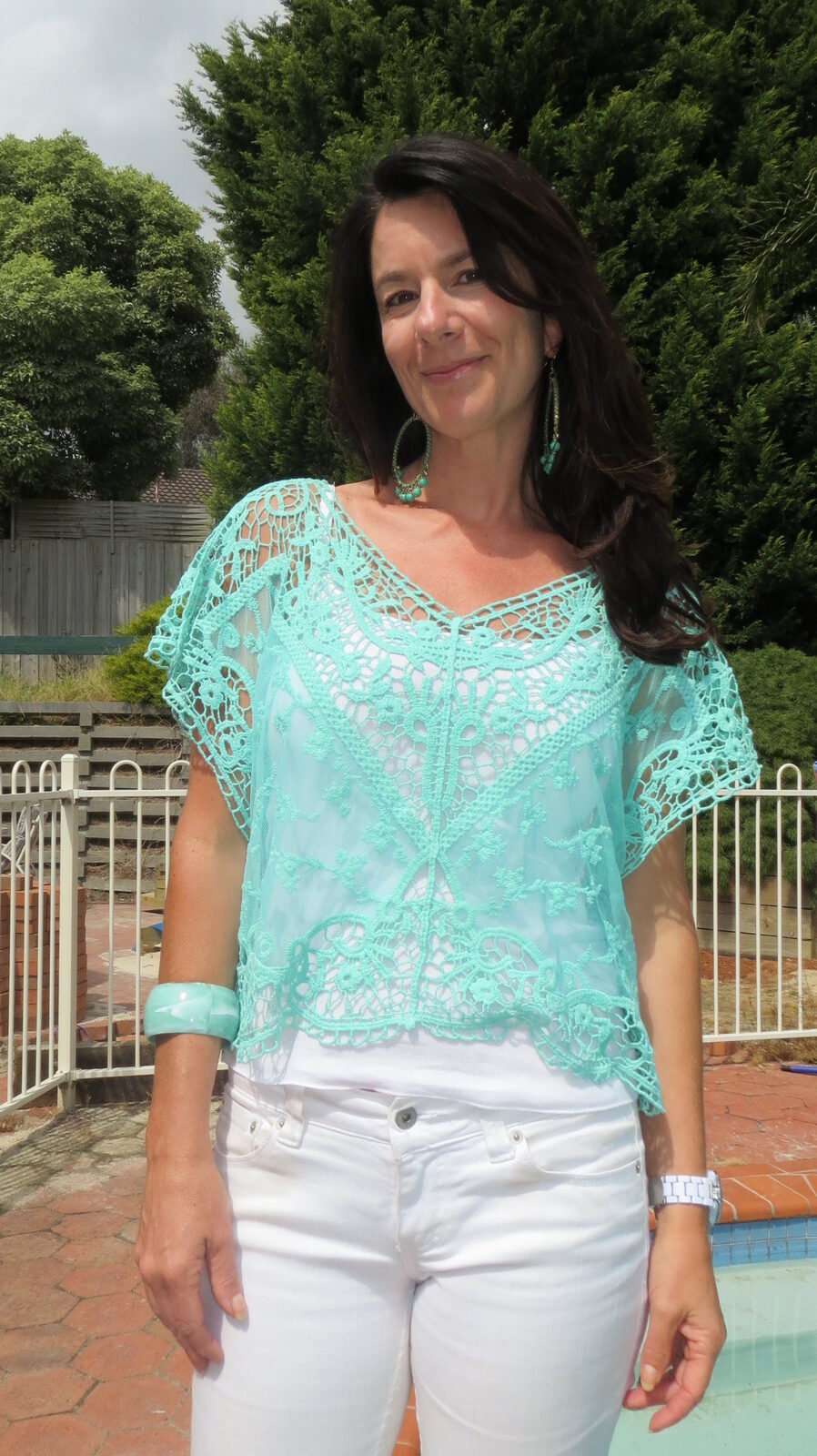 White jeans, green lace top close