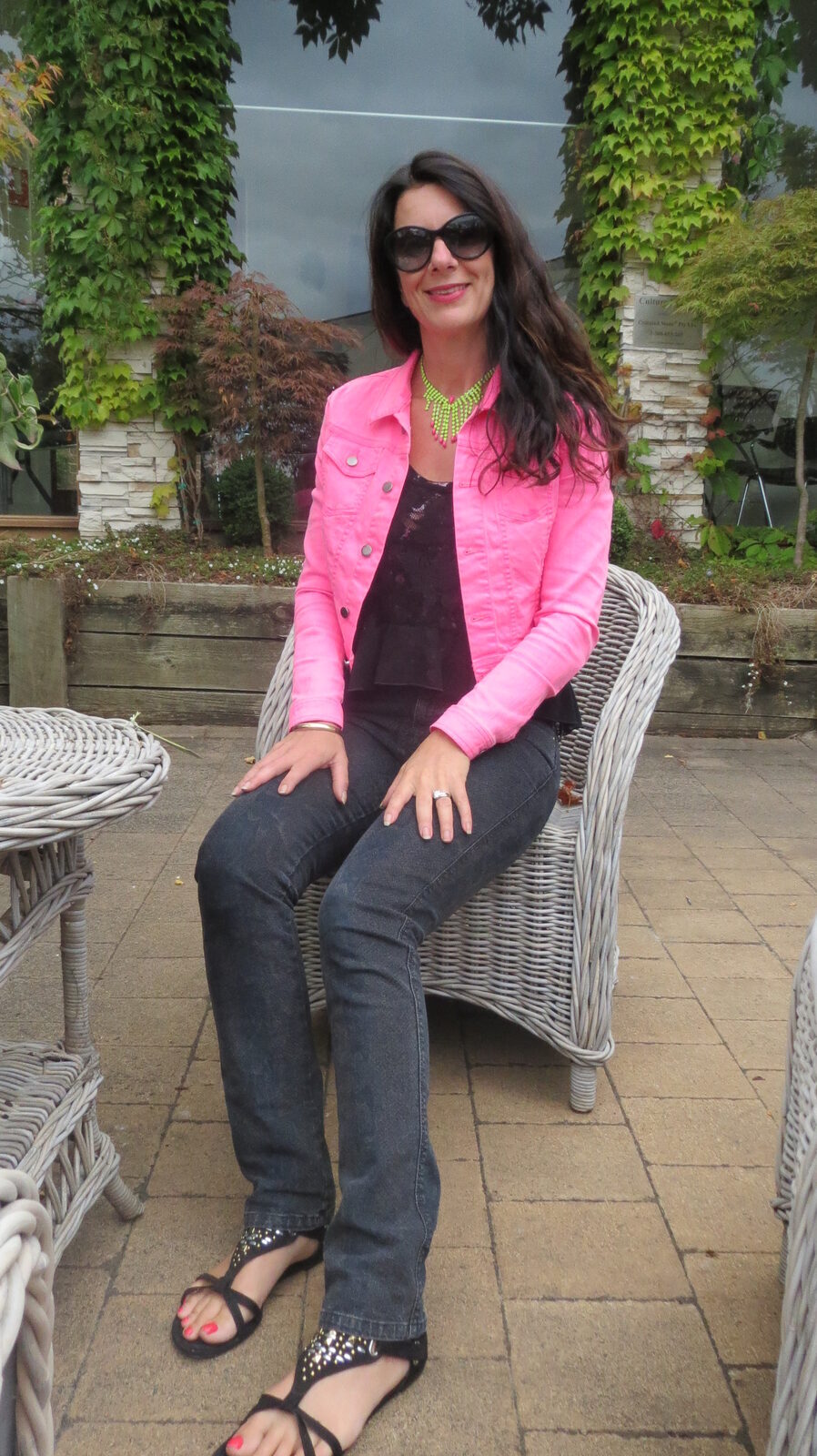 Black snake jeans, neon pink jkt sitting 2
