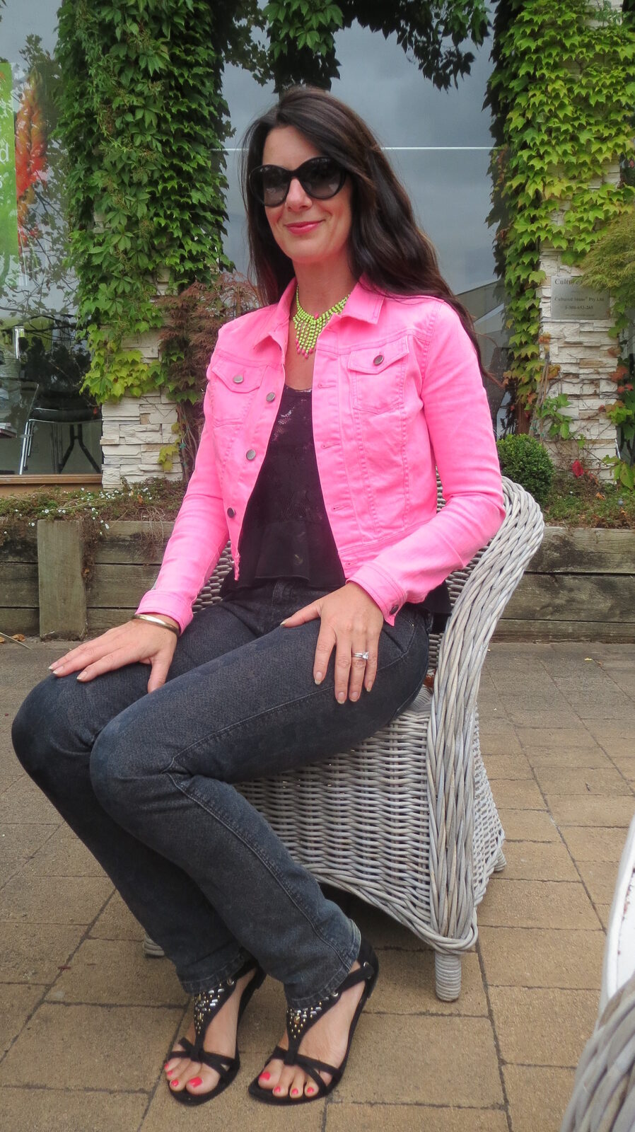 Black snake jeans, neon pink jkt sitting 4
