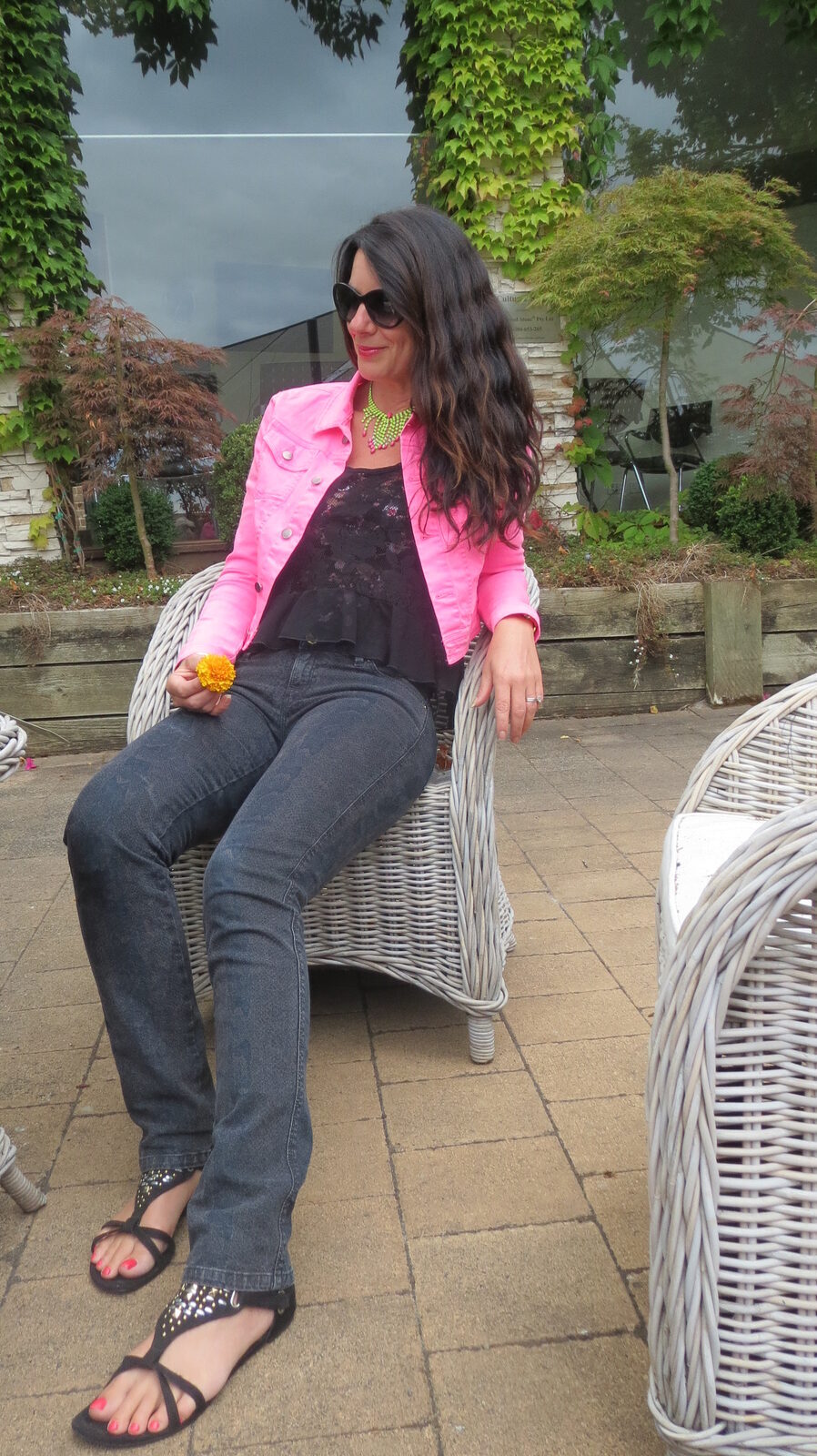 Black snake jeans, neon pink jkt sitting 5
