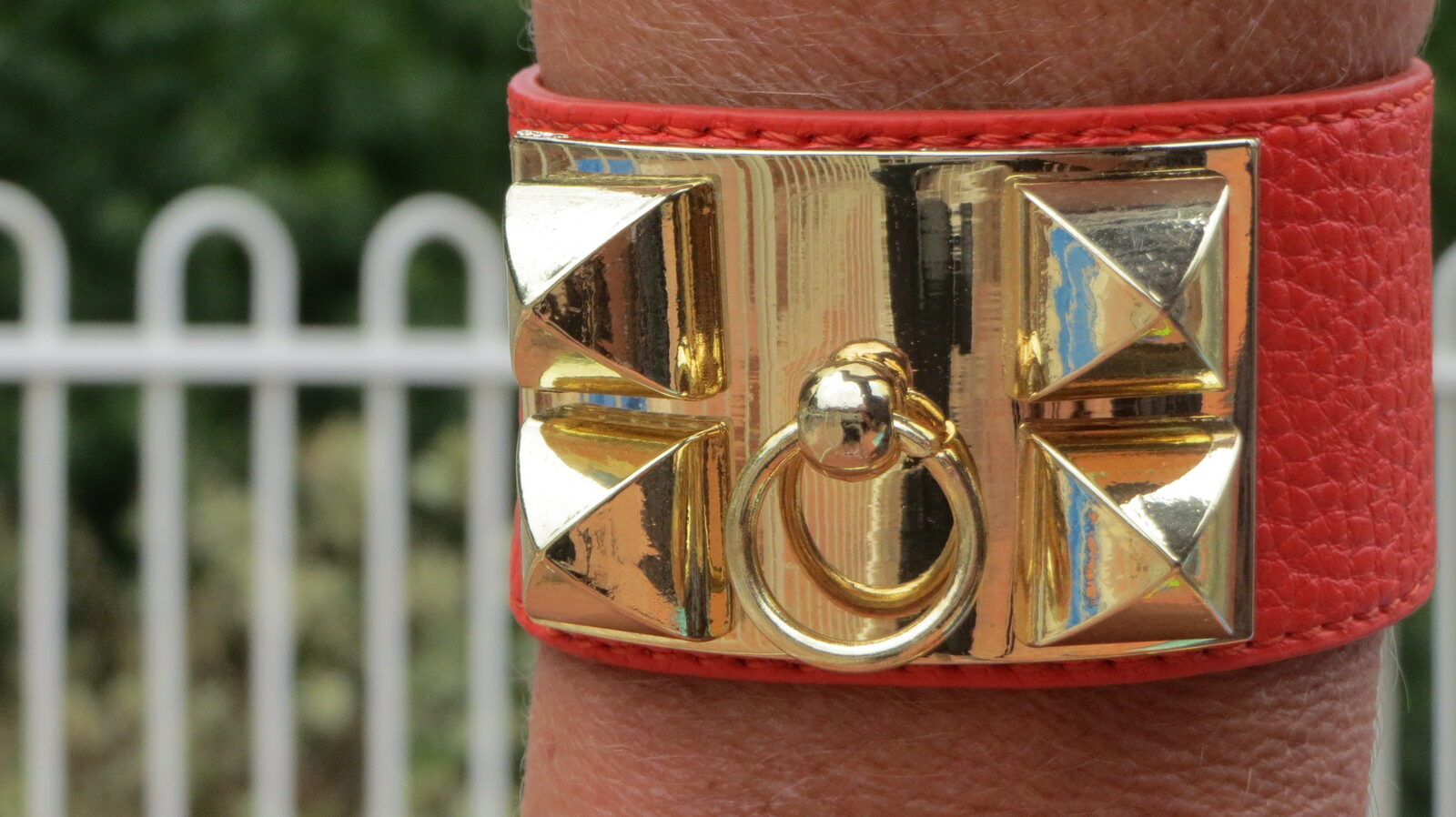 Orange cuff, gold hardware