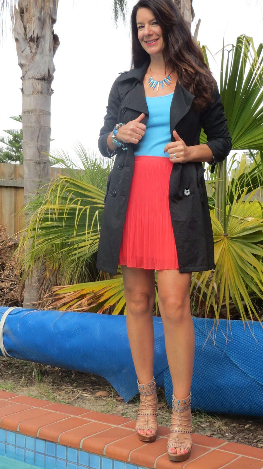 Black trench, watermelon skirt
