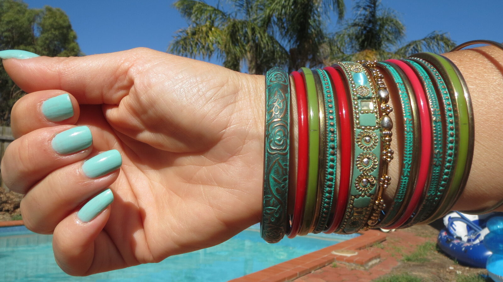 Green & red bracelets, mint nailpolish
