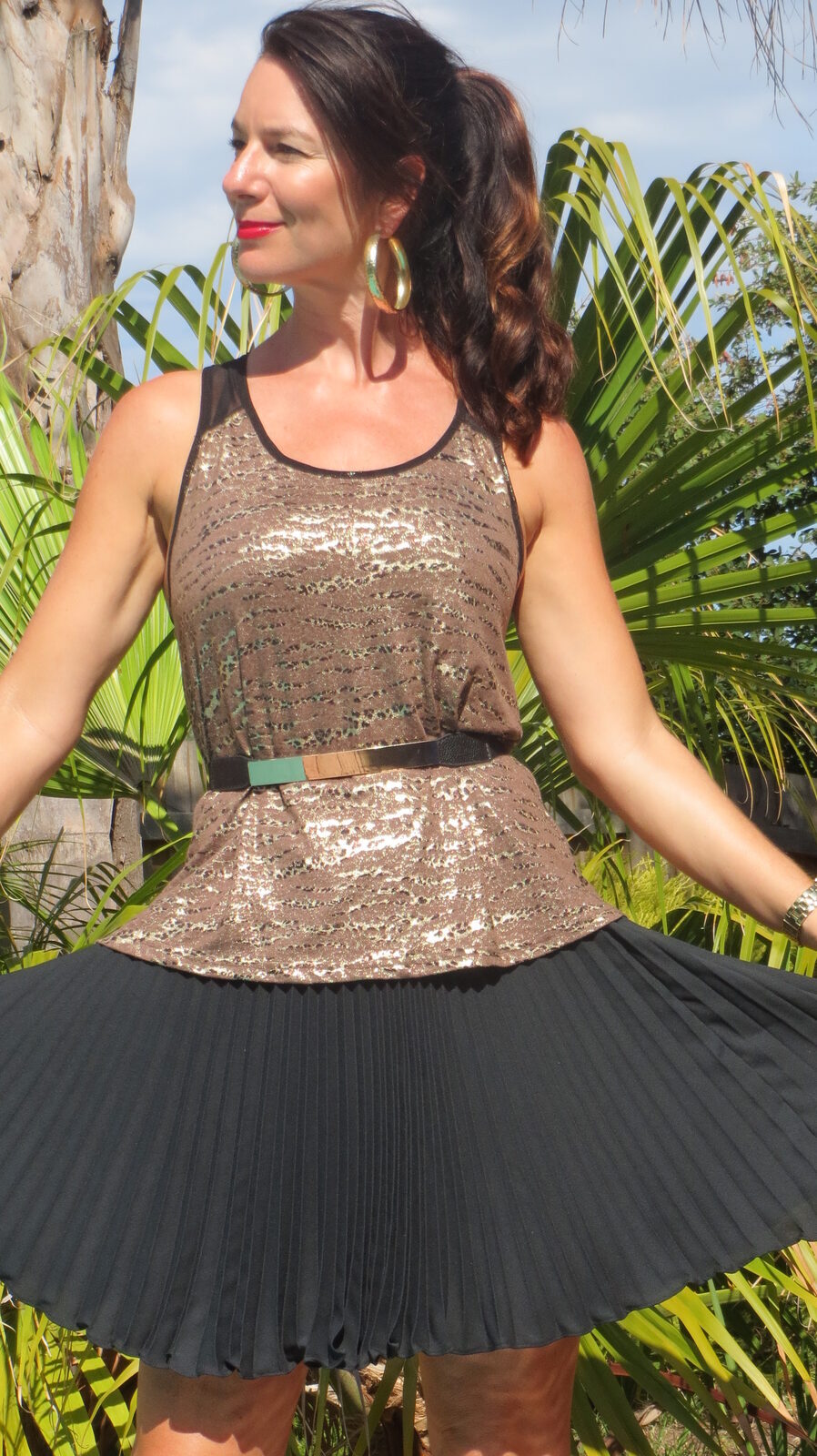 Gold singlet, black pleated skirt 4