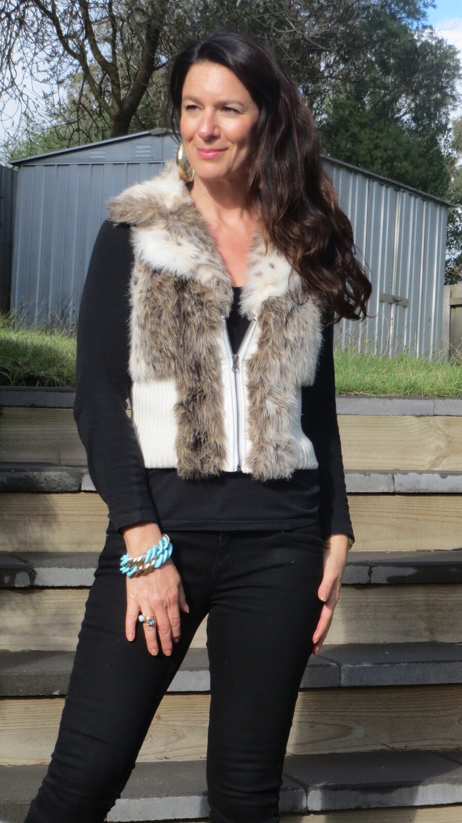 Black jeans, fur vest 2