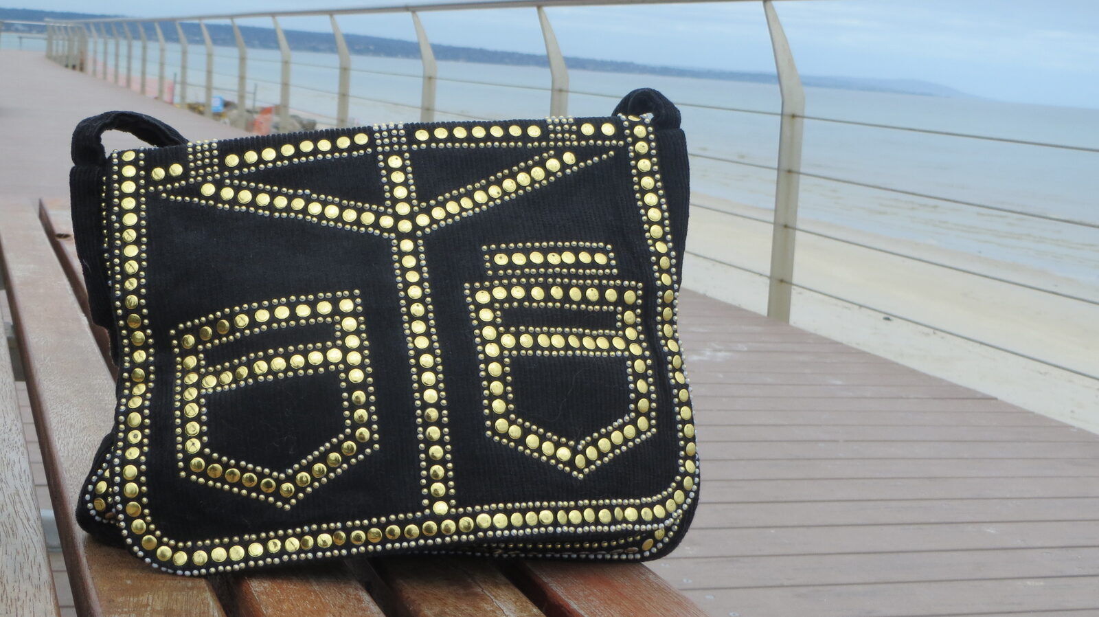 Gold stud handbag