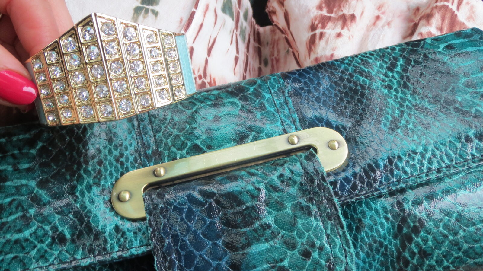 Diamond gold cuff, green snakeskin clutch
